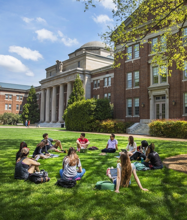 Class in front of Chambers with Students sitting on the grass