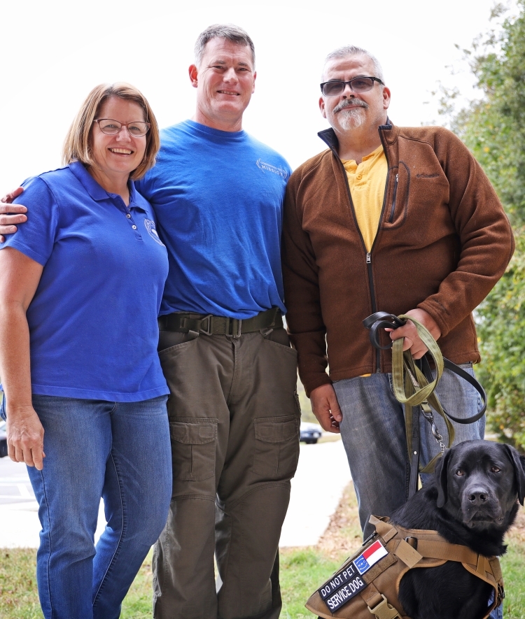 Suzy and Robert Lutz ’87 (left and center), of Continuing the Mission