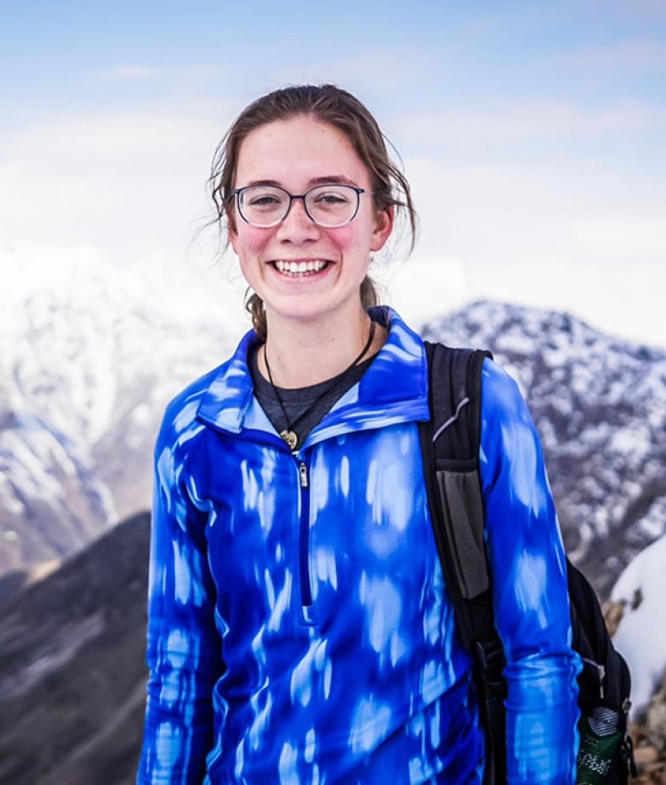 Catherine Cartier in front of mountain landscape