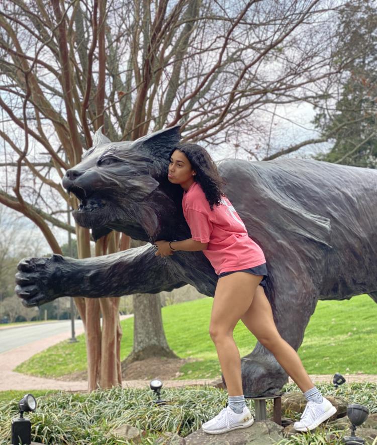 Maliyah Paynter '23 looks sad by Wildcat statue
