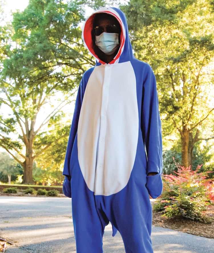 Student Poses in Onesie and Mask