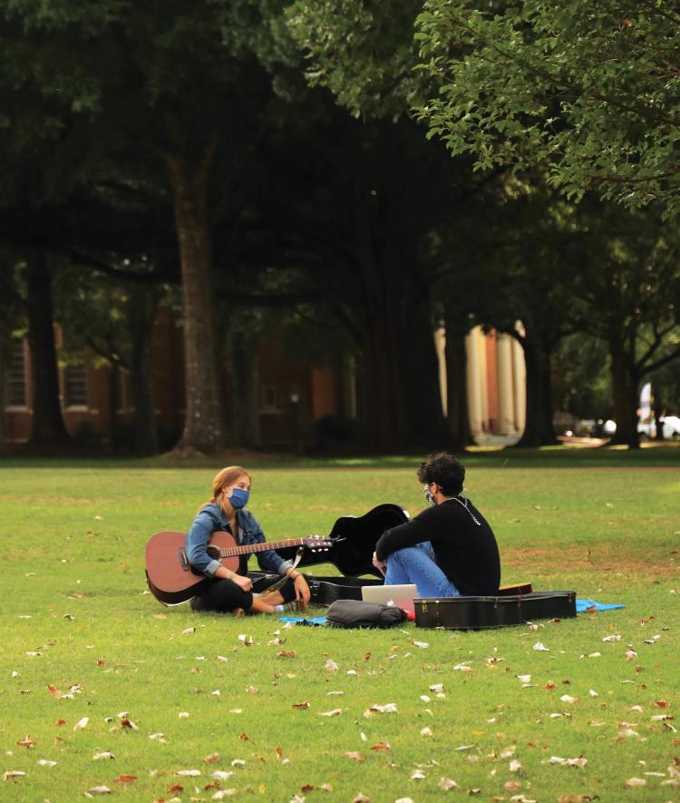 Students Play Instruments on Chambers Lawn in Masks
