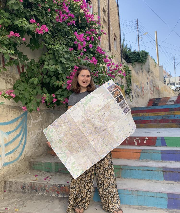 Davidson student with map in Jordan