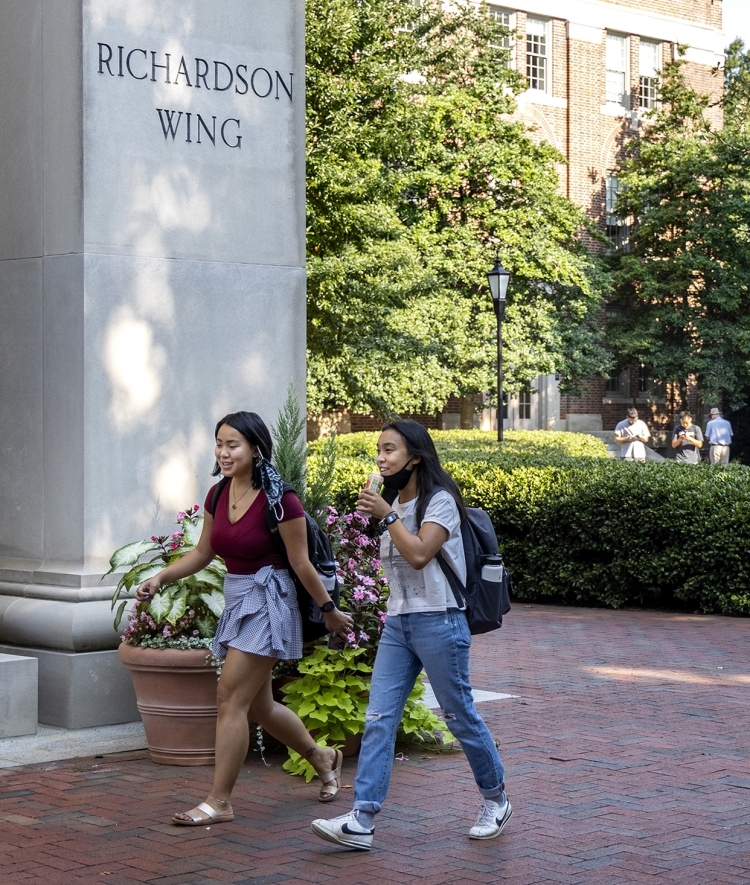 Students Walking on Campus Talking and Smiling
