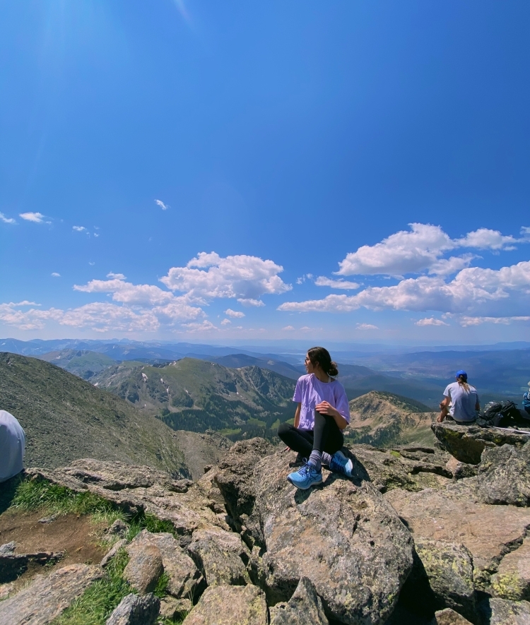 Abigail Giles Sitting Atop a Mountain