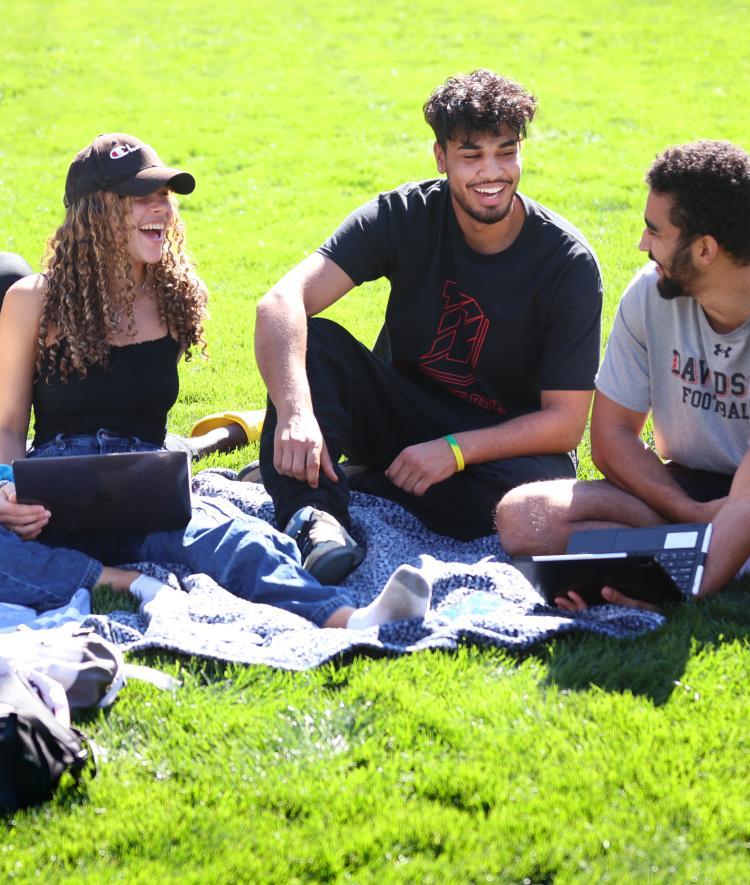 Admission Welcome -- Students Laughing on the green
