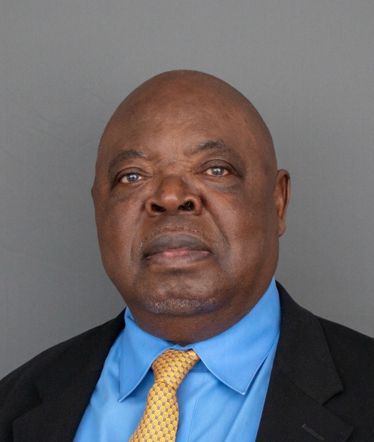 Headshot of Georges Nzongola-Ntalaja '67 in suit and tie