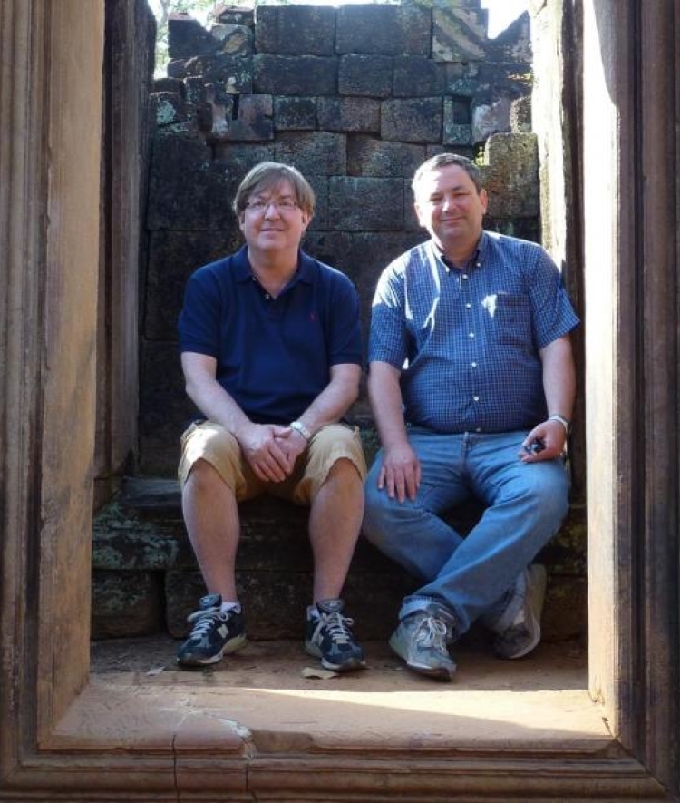 Rick Halton seated with his husband Jean-Marc Frailong