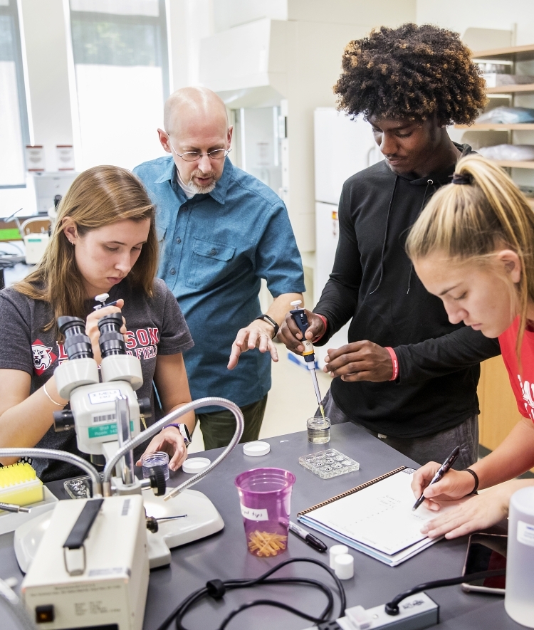 Students and professor in lab