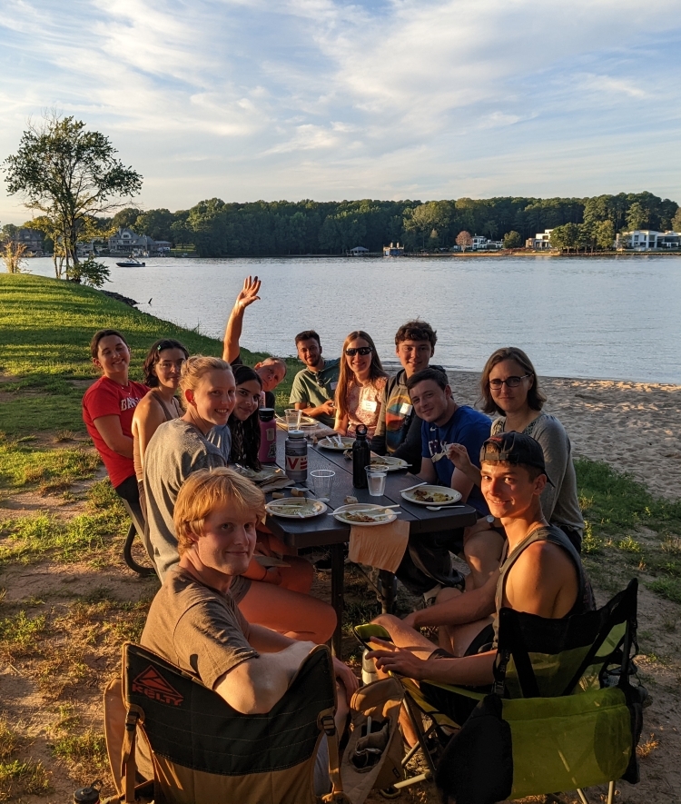 Students eating dinner at lake campus