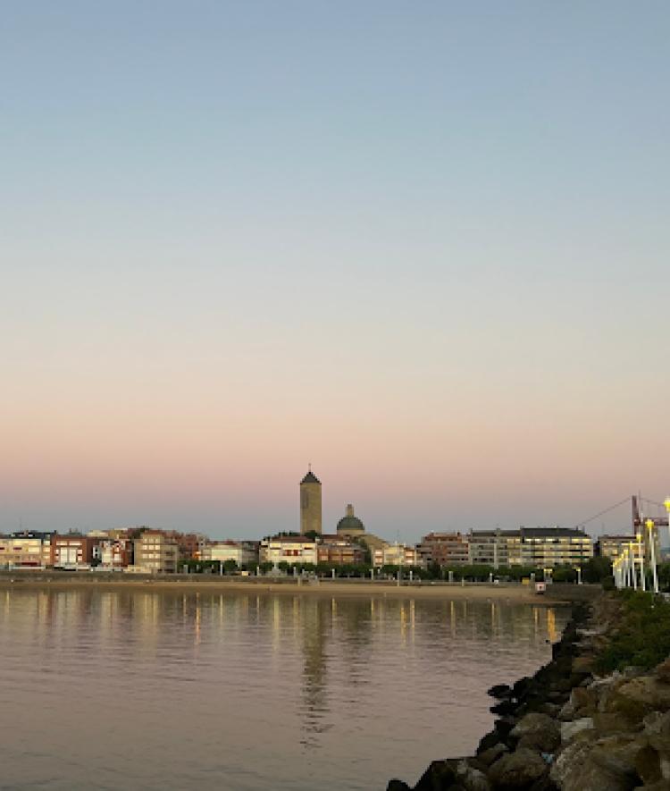 a riverfront at sunset