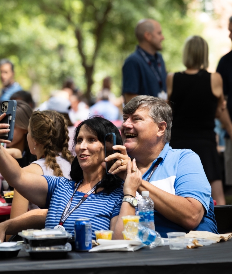 Parents take a selfie at the orientation picnic