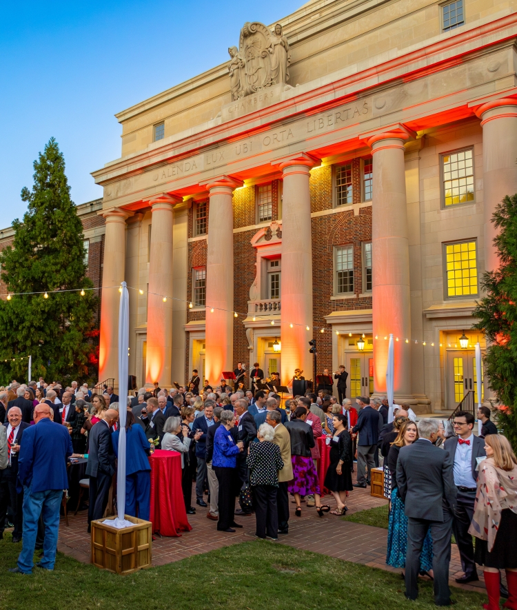 an evening event with string lights on a college campus