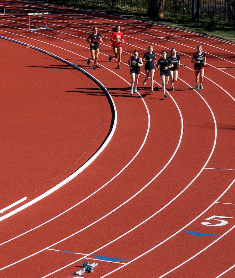 Lisa and Jeff Case Track & Field Complex team running on the track