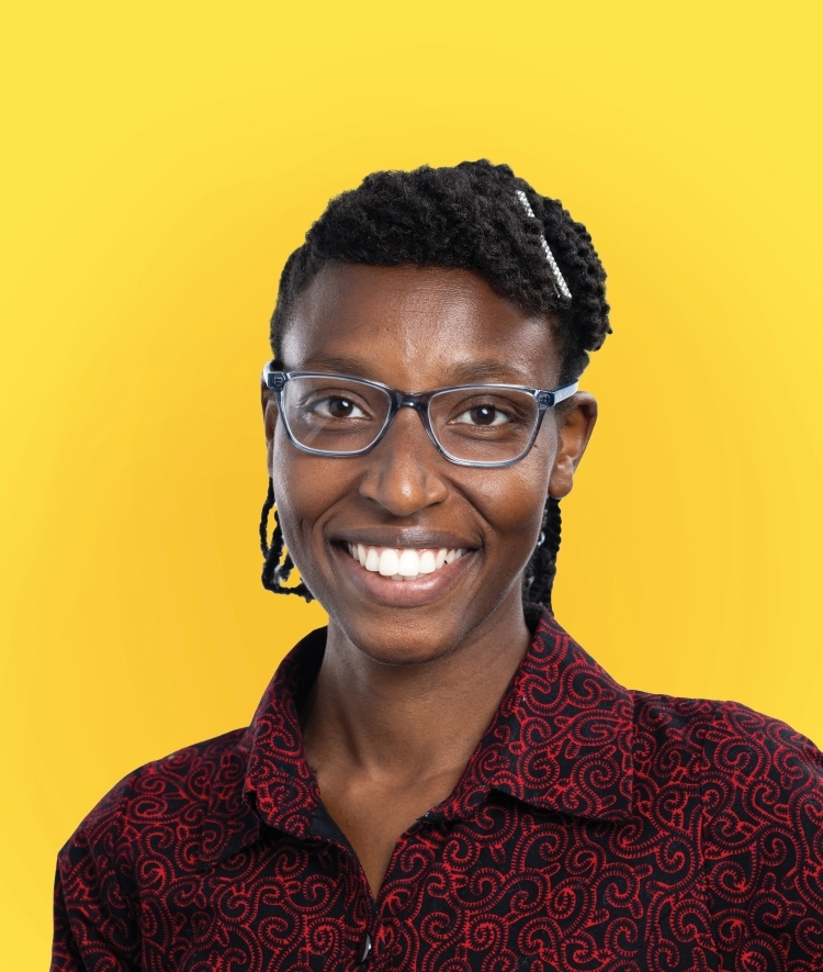 a young Black woman wearing a red collared shirt on a yellow background