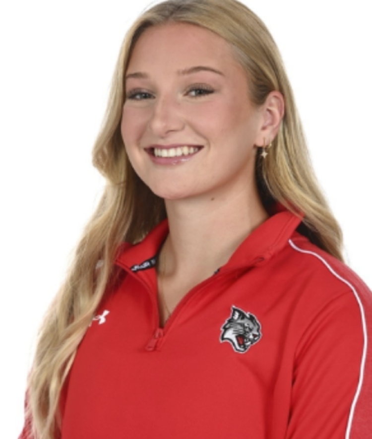 College-age woman with a red Davidson-branded athletic quarter-zip and long blonde hair