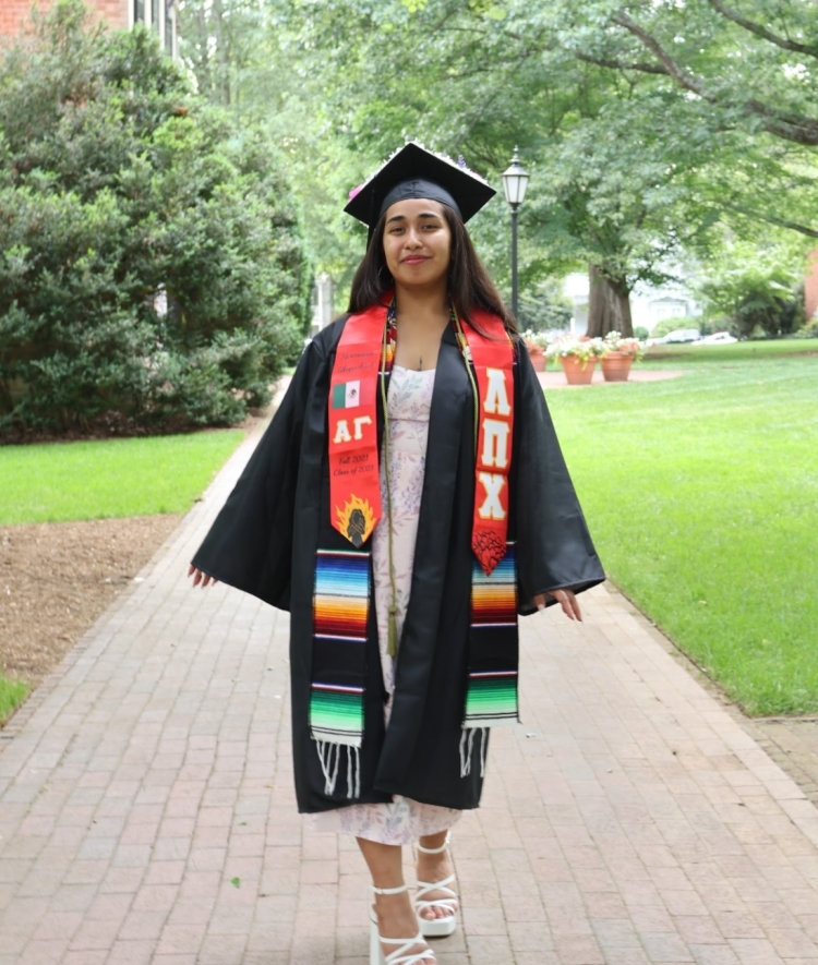 Student in gradation cap and robe