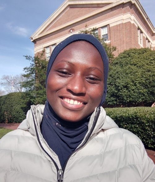 a young Black woman smiling