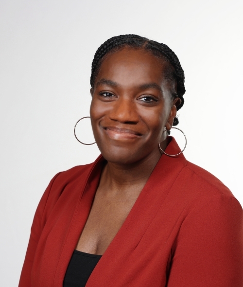 a young Black woman smiling