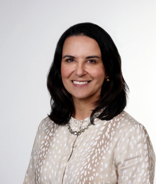 a young white woman with dark brown hair smiling