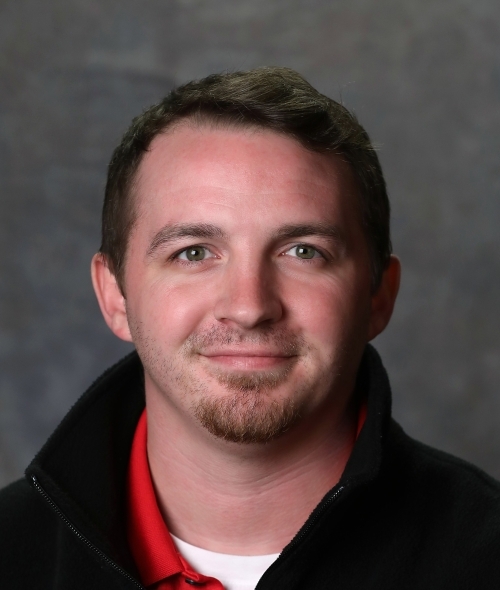 a young white male wearing a black shirt
