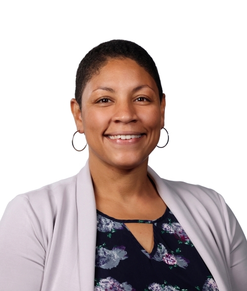 a young Black woman wearing a floral top