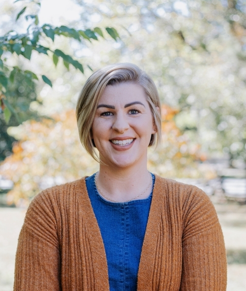 a young white woman with short blonde hair