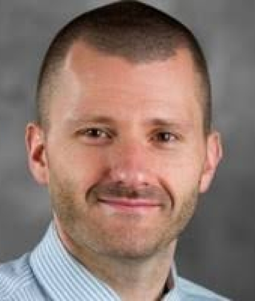 Soft smiling adult man, white, approximately 25-40 years of age