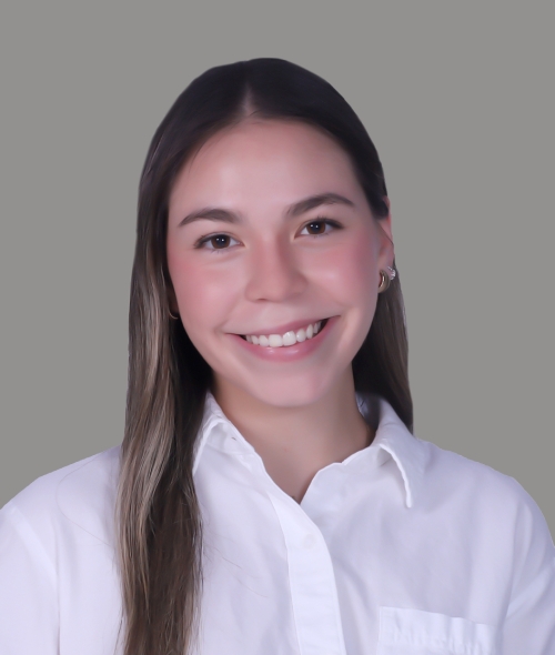 A young woman with long brown hair and a white button down