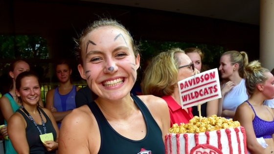 Cake race winner holds a cake