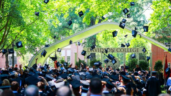 Commencement Graduates throw Hats in the Air