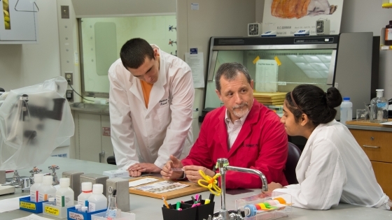 Julio Ramirez in Lab with Students