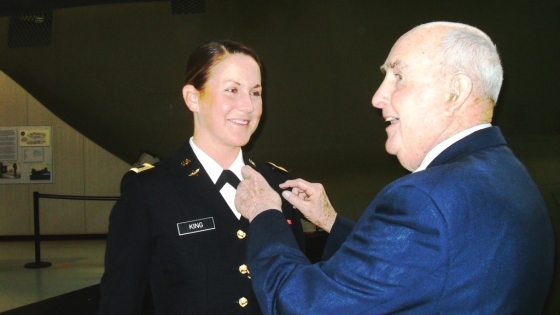 Alumnus Retired Air Force Brigadier General John Rose pins aviator wings on granddaughter Emily King
