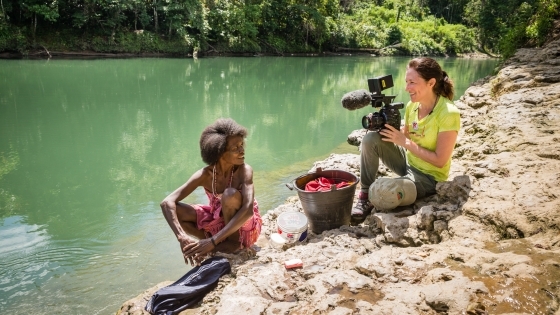 Mary Olive Smith Shooting Documentary with Woman Smiling