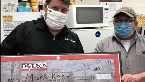 Mark Knox and David Holthouser with $1,000 prize check