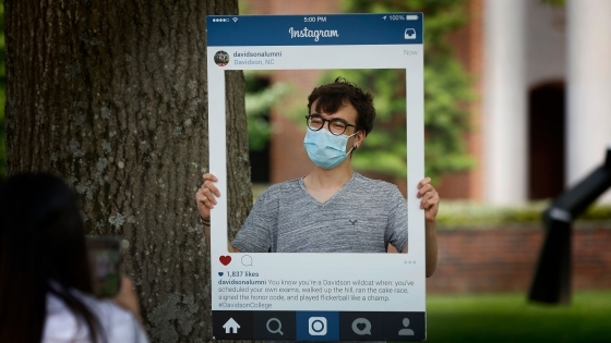 student poses in Instagram image card popup card