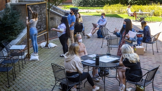 Professor teaching outdoors