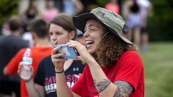 Person Laughs While Recording the Cake Race