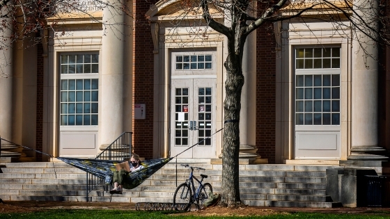 Campus Scenes Student in hammock with bicycle