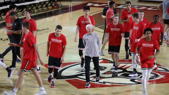 Davidson College men's basketball team on court with head coach Bob McKillop