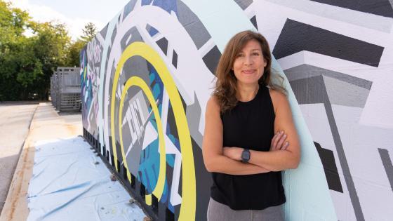 Davidson College Prof. Joelle Dietrick poses by mural project at Dickinson College