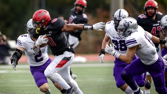 Davidson Football player takes off with ball