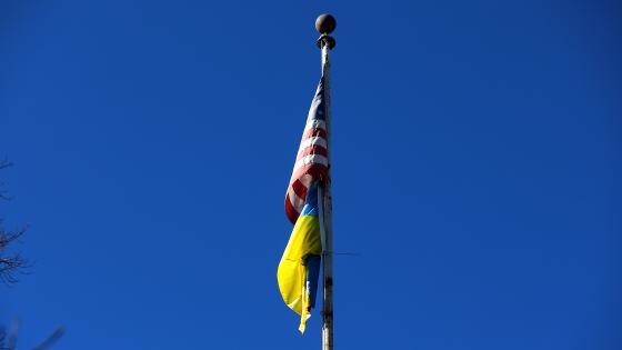 campus flagpole with U.S. and Ukraine flag hanging