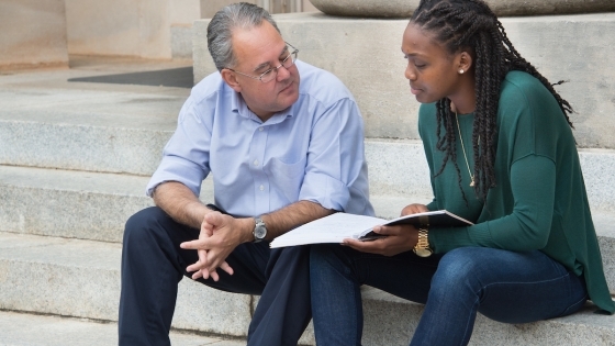 Prof. Samuel Sánchez y Sánchez converses with student