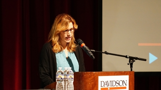 Writer Molly Sentell Haile speaking at podium