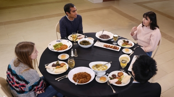 Students at table with food in front of them