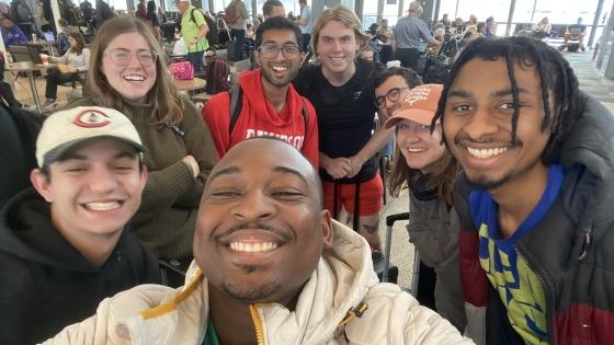Group of students taking a selfie in the airport