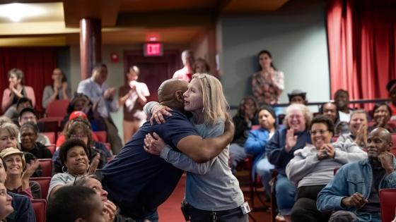 Two Davidson employees hug at Employee Appreciation ceremony
