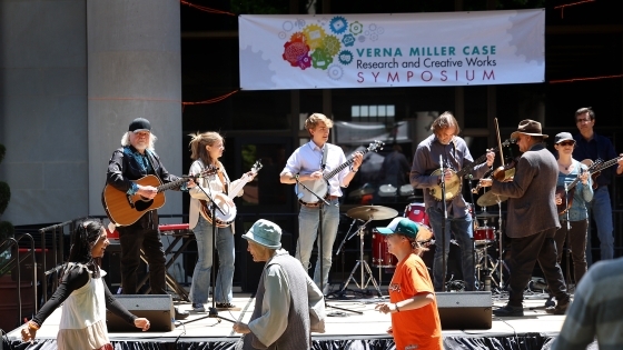 scenes of people dancing in front of a band