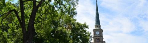 Davidson College Presbyterian Church steeple through the trees